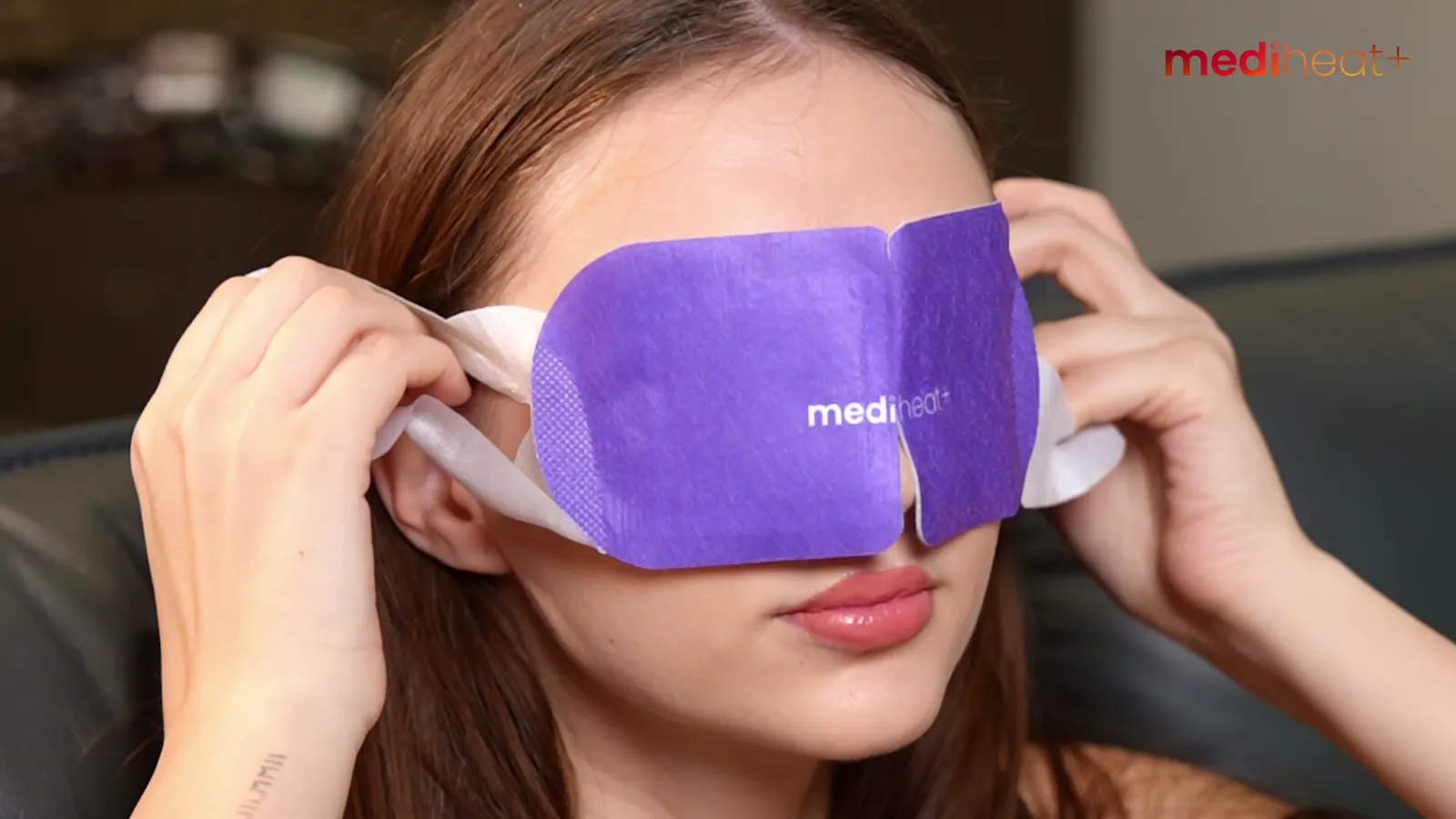 A woman relaxing with a MediHeat+ Sight Soothe eye heating patch